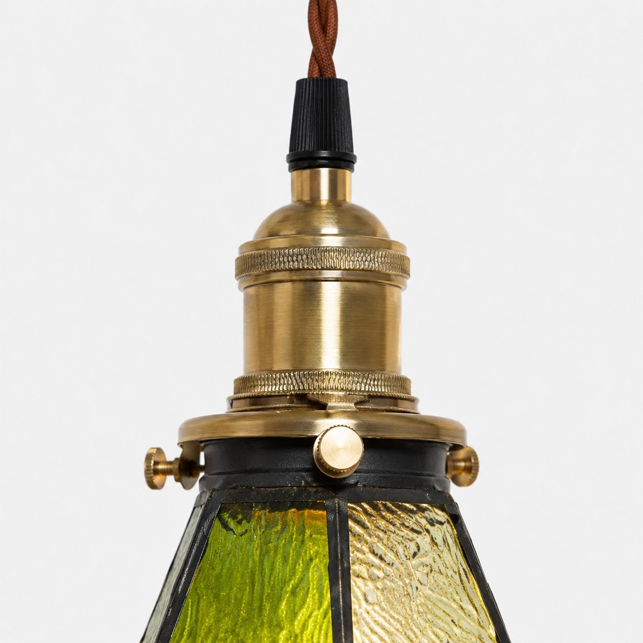 green amber stained glass pendant light detail or room scene