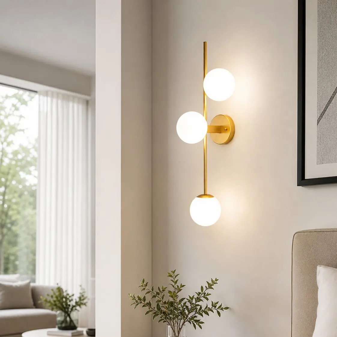 Three-light glass wall sconce in a styled interior